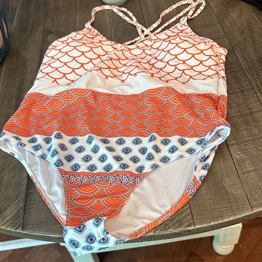 Womens Swimwear with Orange and White Pattern.